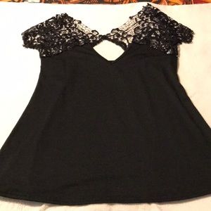 Gorgeous black top with lace upper and sleeves.